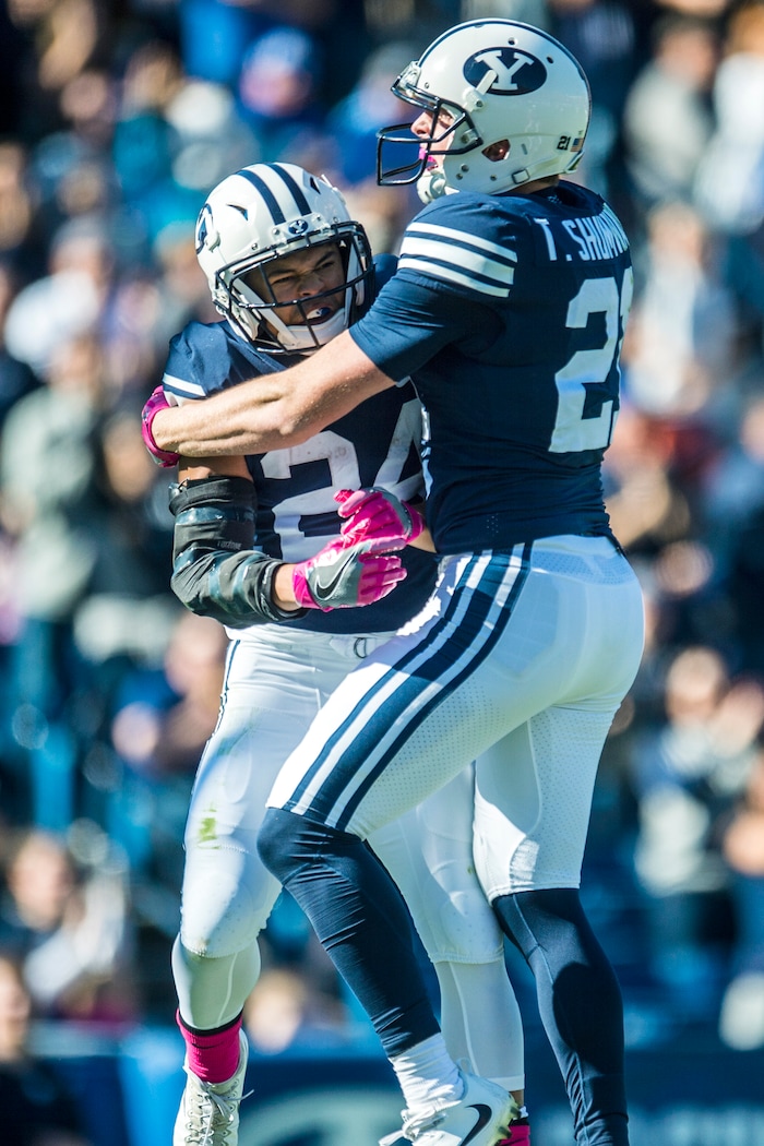 (Chris Detrick  |  The Salt Lake Tribune)  Brigham Young Cougars running back KJ Hall (24) celebrates his 75-yard touchdown with Brigham Young Cougars wide receiver Rickey Shumway (20) during the game at LaVell Edwards Stadium Saturday, October 28, 2017.  