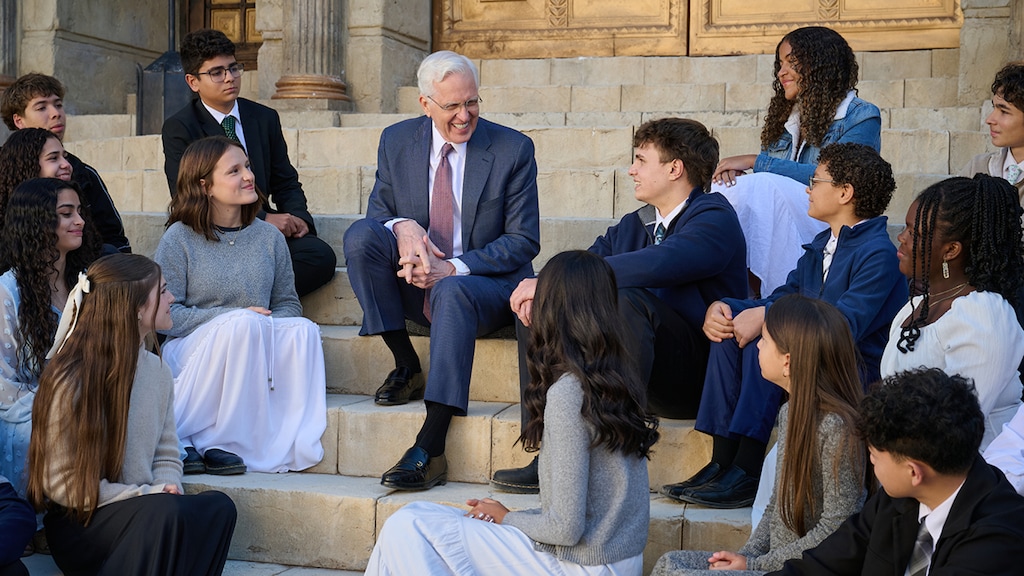 (The Church of Jesus Christ of Latter-day Saints) President D. Todd Christofferson talks to a youth group during a “Walk With Me," recorded on the Jerusalem movie set in Goshen, Utah, in January. Latter-day Saint youth groups soon will meet in their Sunday classes weekly.