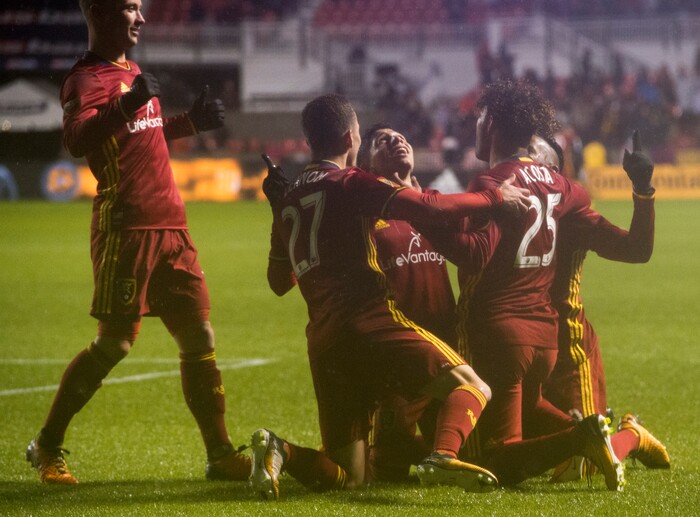 (Rick Egan  |  The Salt Lake Tribune)  Real Salt Lake celebrates their first goal on a rainy night, in MLS soccer action, Real Salt Lake vs Seattle Sounders, in Sandy, Saturday, September 23, 2017.