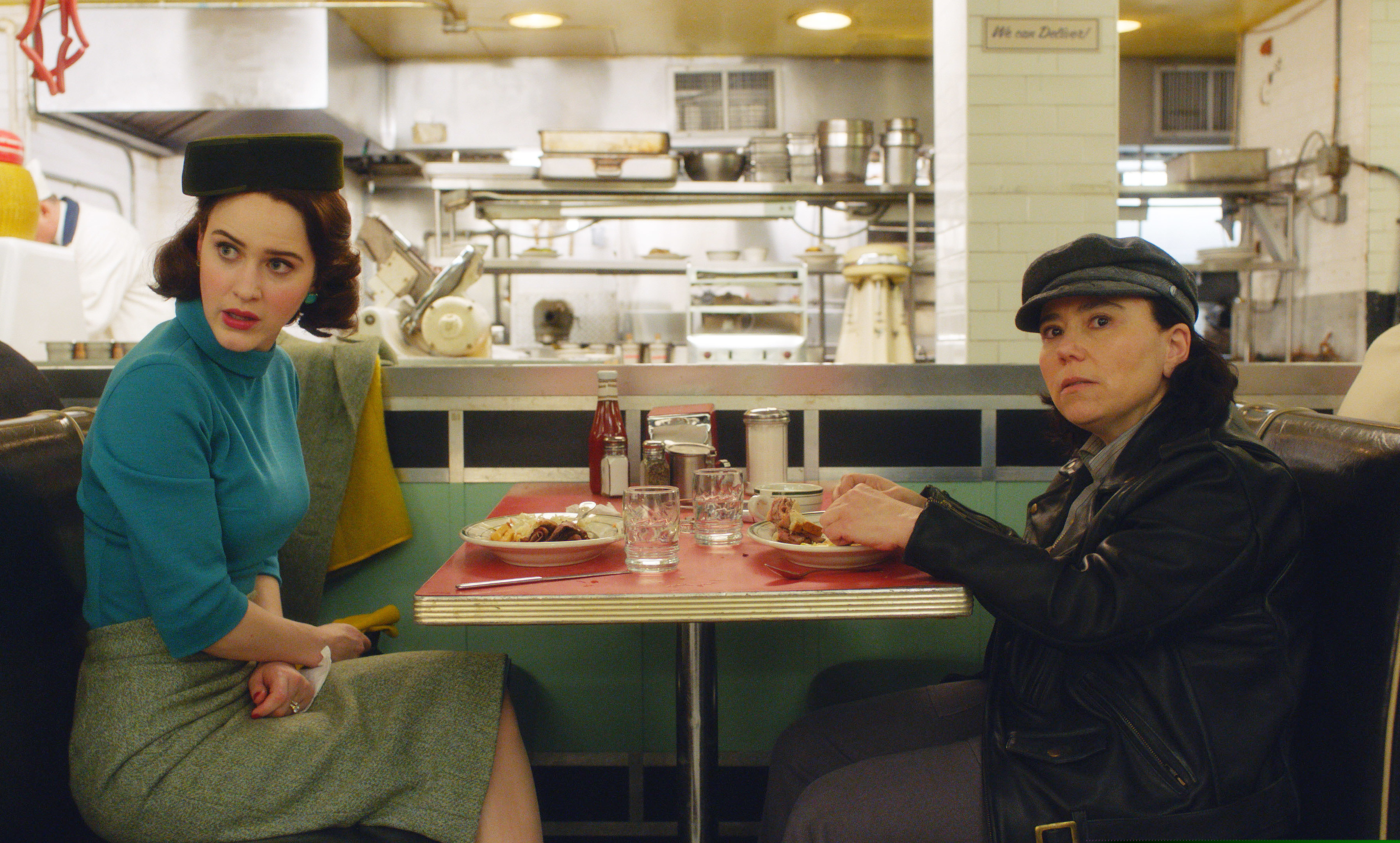 This image released by Amazon shows Rachel Brosnahan, left, and Alex Borstein in a scene from "The Marvelous Mrs. Maisel." On Thursday, Dec. 6, 2018, Borstein was nominated for a Golden Globe award for supporting actress in a series, limited series or TV movie for her role. The 76th Golden Globe Awards will be held on Sunday, Jan. 6. (Amazon via AP)