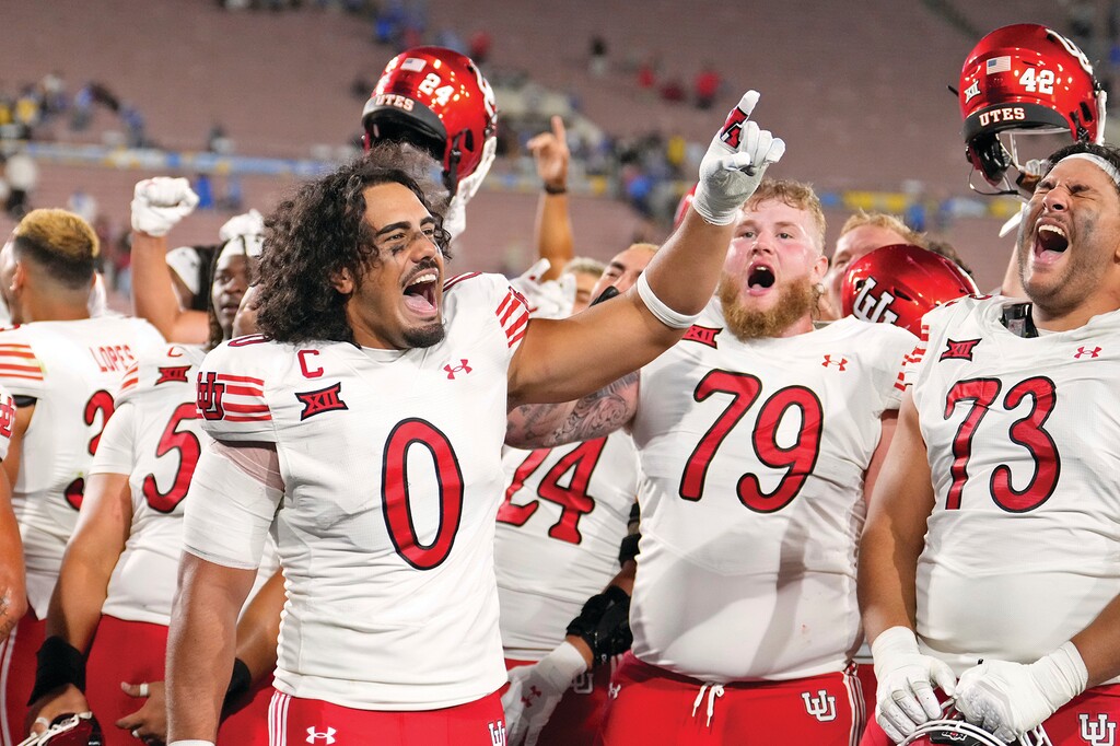 Utah players, including Utah defensive end Logan Fano (0) celebrate after Utah defeats UCLA in an NCAA college football game, Saturday, Aug. 30, 2025, in Pasadena, Calif. (AP Photo/Mark J. Terrill)