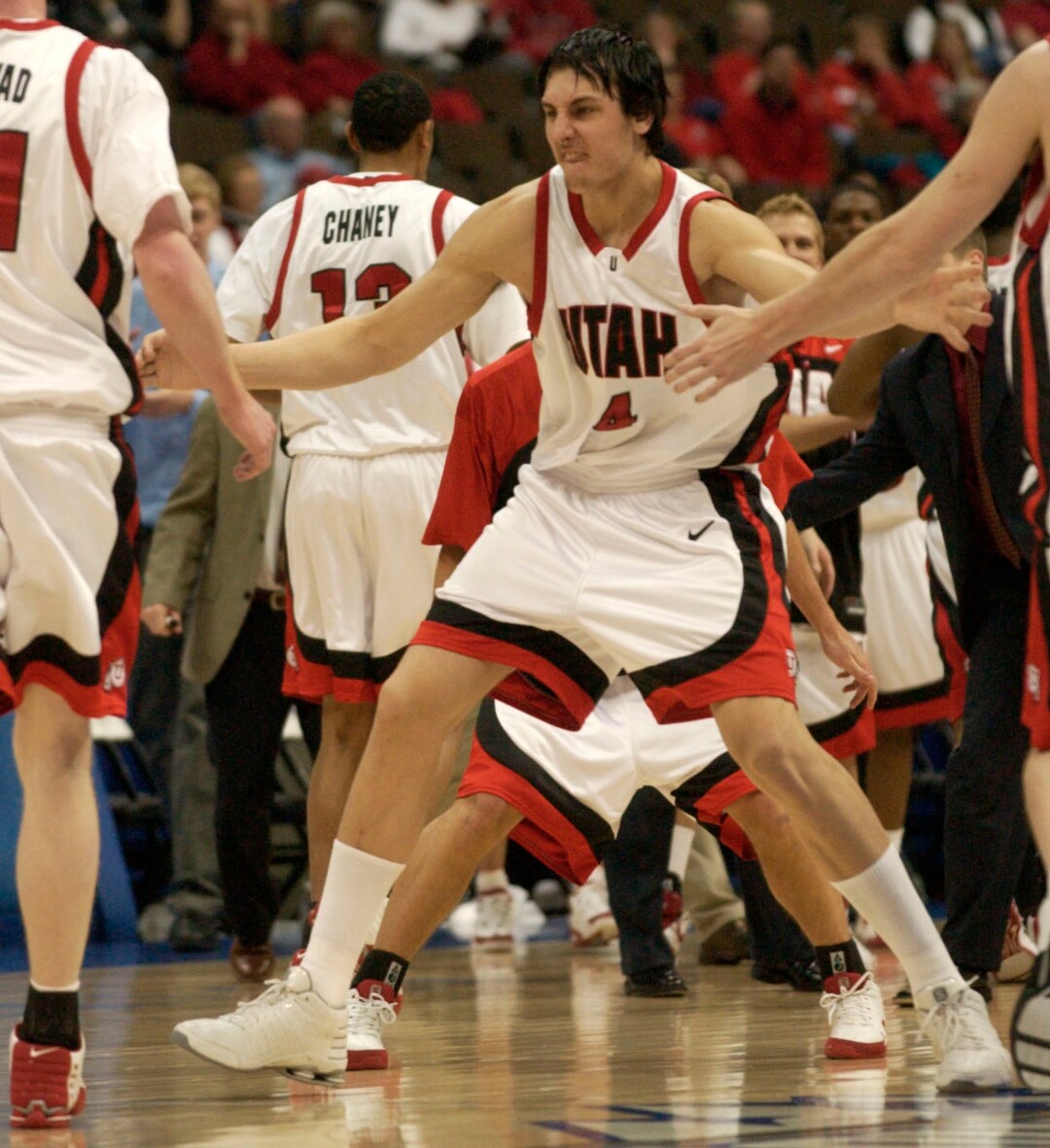 Andrew Bogut runs unto the court to congratulate his teammates after Jonas Langvad's three pointer forced UNLV to call a timeout during first half action in the Utah UNLV men's basketball game at the Pepsi Center in Denver March 11., 2005 3/11/05 Griffin/photo