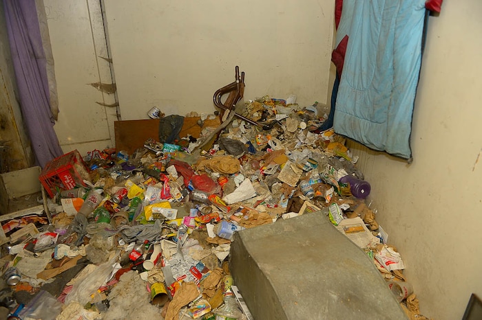 (Trent Nelson | The Salt Lake Tribune) Garbage from squatters fills the basement of a dilapidated, fire-damaged building near 100 South 700 East in Salt Lake City, Thursday Feb. 15, 2018. Other Side Academy has received approval to demolish it for their expansion.
