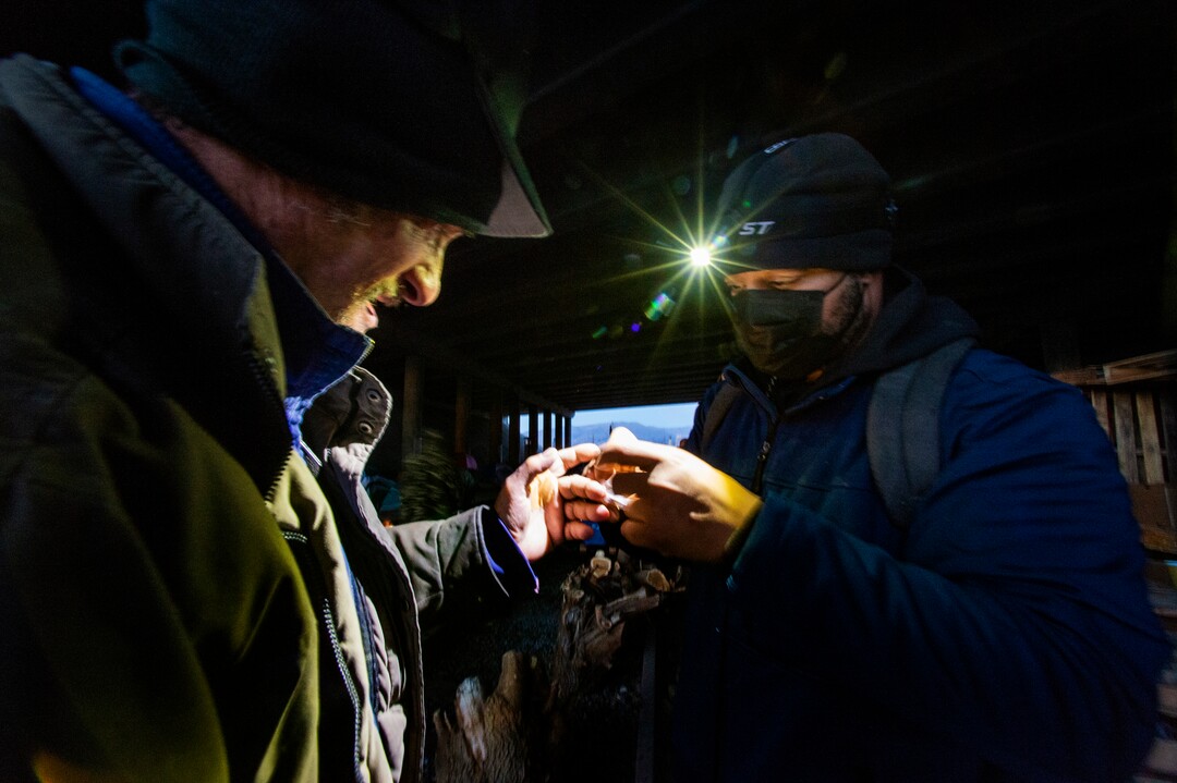 (Rick Egan | The Salt Lake Tribune) Kay Jay, a volunteer at Camp Last Hope, puts bandages on the hand of one of the residents of the camp, on Friday, Jan. 1, 2021.