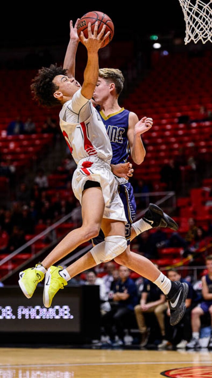 (Trent Nelson | The Salt Lake Tribune)  Skyline vs. Bountiful, 5A State high school basketball tournament at the Huntsman Center in Salt Lake City, Wednesday Feb. 28, 2018. Bountiful's Isaac Kime (0) shoots over Skyline's Briggs Binford (2).