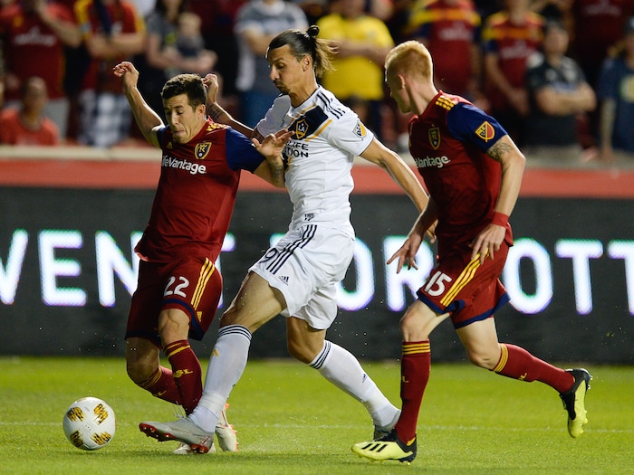 (Francisco Kjolseth  |  The Salt Lake Tribune)  Los Angeles Galaxy forward Zlatan Ibrahimovic (9) gets heavy pressure from RSL during the first half of the MLS soccer match Saturday, Sept. 1, 2018, in Sandy at Rio Tinto Stadium.