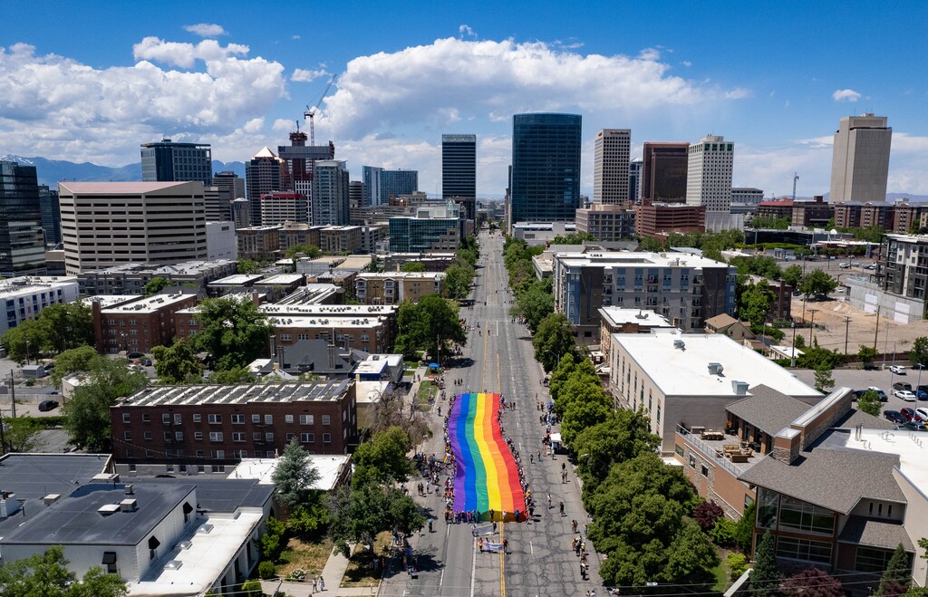 (Francisco Kjolseth | The Salt Lake Tribune) The large rainbow flag that takes up the rear of the Utah Pride Parade is carried in Salt Lake City on Sunday, June 4, 2023. Several recent data sources suggest that about 6 to 8% of Utah adults identify as LGBTQ.