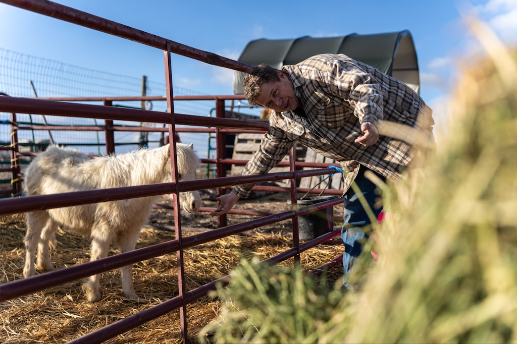 (Xiangyao “Axe” Tang  |  Amplify Utah) Tooele County resident Chris Eddington, whose backyard borders the recently approved Tooele Valley inland port project, pets his pony on February 27, 2024.