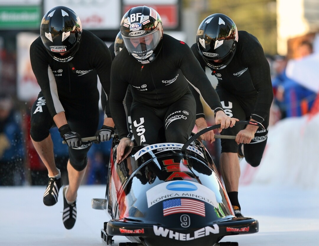 Bob USA 1 starts with pilot Steven Holcomb, in front, Steve Mesler, Brock Kreitzenburg and Paul Jovanovic, behind from left, to the first of four runs of the Four Men Bob World Championship in St. Moritz, Switzerland, Saturday, Feb. 3, 2007. (AP Photo/Eckehard Schulz)