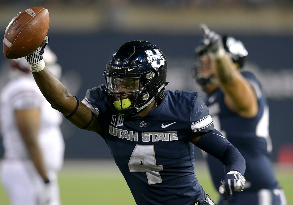 Utah State safety Aaron Wade (4) celebrates after intercepting a New Mexico State pass during an NCAA college football game Saturday, Sept. 8, 2018, in Logan, Utah. (Eli Lucero/The Herald Journal via AP)