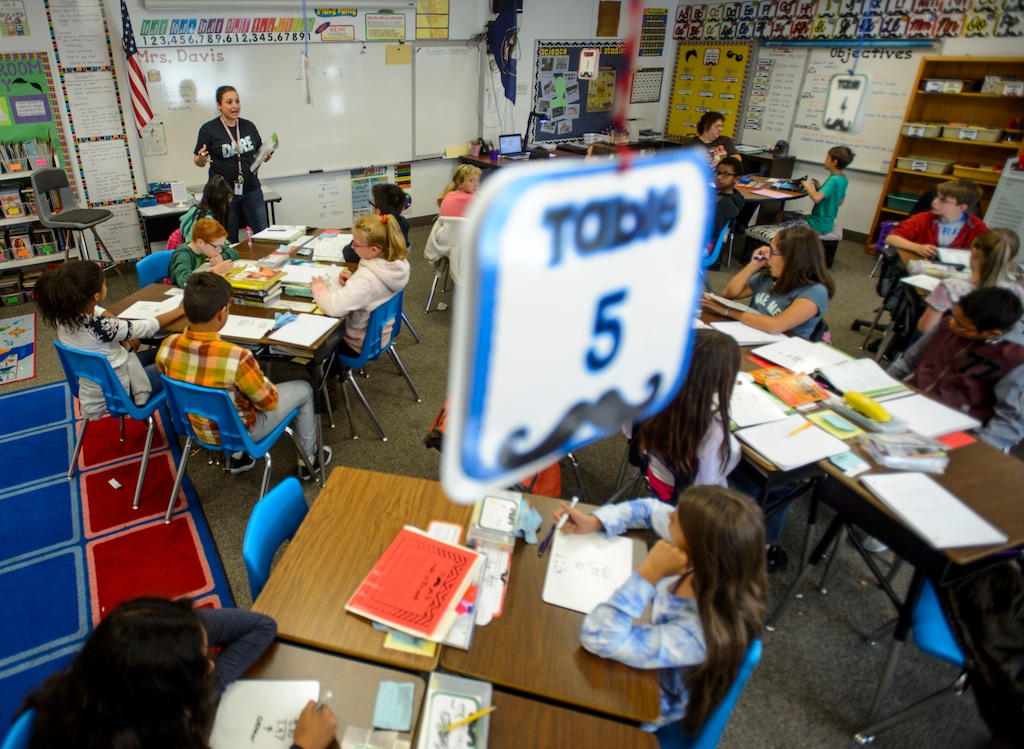 (Steve Griffin | Tribune file photo) Raschell Davis works with her fifth-grade students at East Midvale Elementary School in Midvale in 2017. The school is in the Canyons School District, which is seeking a 9.45% property tax increase, about $140.32, to pay for an increase in teacher salaries.