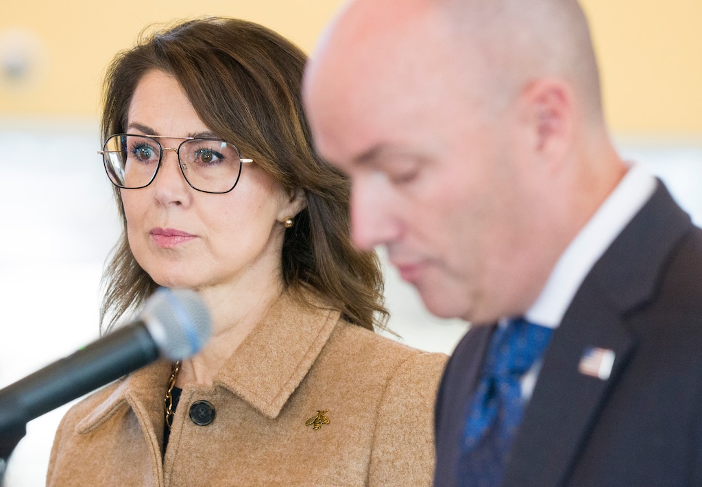 (Bethany Baker | The Salt Lake Tribune) Lt. Gov. Deidre Henderson listens to Gov. Spencer Cox during a news conference on the 2027 fiscal budget at Kearns Library in Kearns on Wednesday, Dec. 3, 2025.