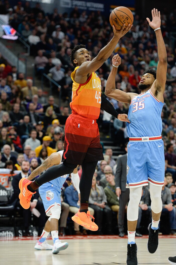 (Francisco Kjolseth  |  The Salt Lake Tribune)  Utah Jazz guard Donovan Mitchell (45) tries to shoot past Sacramento Kings forward Marvin Bagley III (35) in the Kings in the NBA game at Vivint Smart Home Arena Wed., Nov. 21, 2018, in Salt Lake City.