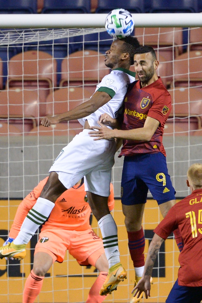 (Leah Hogsten  |  The Salt Lake Tribune) Real Salt Lake forward Justin Meram (9) and Portland Timbers forward Jeremy Ebobisse (17) battle for possession at the net as Real Salt Lake hosts the Portland Timbers, Oct. 14, 2020.