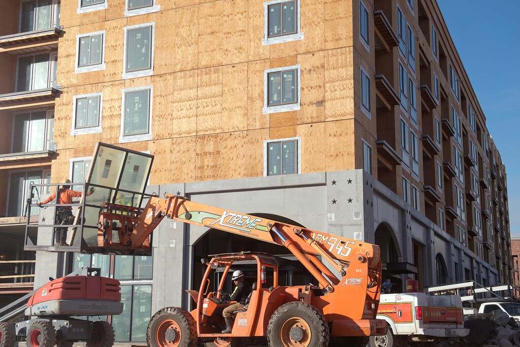 (Tyler Cobb  |  Tribune file photo)  Construction crews work on the apartment buildings at the Hardware District in Salt Lake City on Jan. 23, 2018.