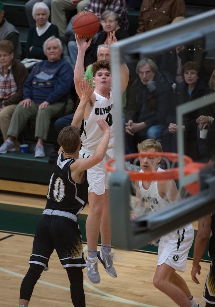 (Scott Sommerdorf | The Salt Lake Tribune)
Jeremy Dowdell scores one of his three-point shots during first half play as Olympus defeated Highland 70-49, Friday, January 19, 2018.