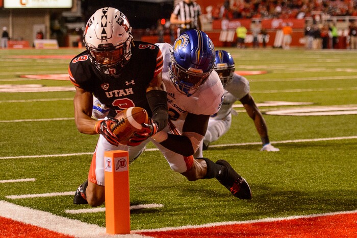 (Trent Nelson | The Salt Lake Tribune) Utah Utes wide receiver Darren Carrington II (9) scores a touchdown, with San Jose State Spartans linebacker Jamal Scott (42) defending, as the Utah Utes host the San Jose State Spartans, NCAA football at Rice-Eccles Stadium in Salt Lake City, Saturday September 16, 2017.