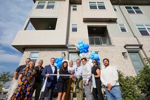 (Chris Samuels | The Salt Lake Tribune) Clark Ivory, CEO of Ivory Homes, leads a ribbon cutting for Innovation Park at Holbrook Farms, a restricted-income town home development in Lehi, Wednesday, Sept. 11, 2024.