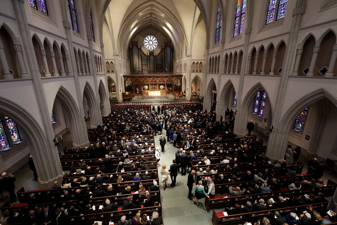 Attendees arrive at St. Martin's Episcopal Church for a funeral service for former first lady Barbara Bush, Saturday, April 21, 2018, in Houston. (AP Photo/David J. Phillip , Pool)