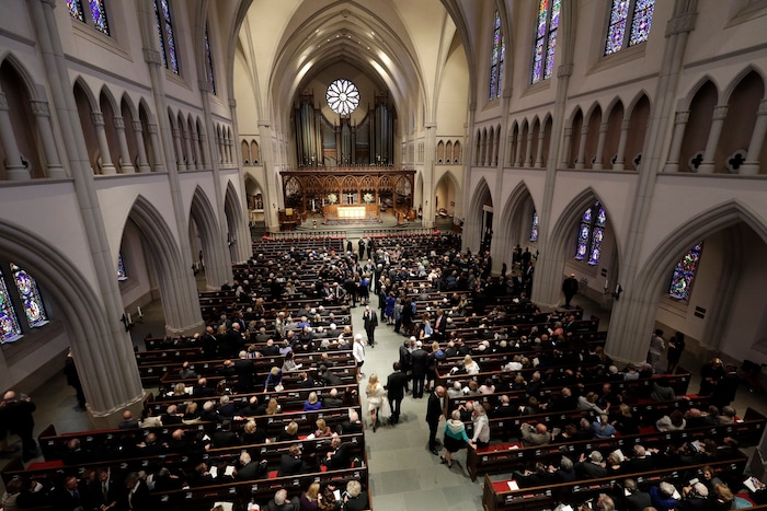 Attendees arrive at St. Martin's Episcopal Church for a funeral service for former first lady Barbara Bush, Saturday, April 21, 2018, in Houston. (AP Photo/David J. Phillip , Pool)