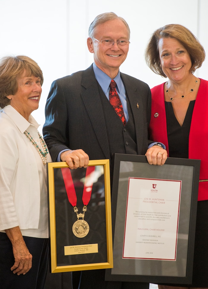 (Rick Egan  |  The Salt Lake Tribune)     Karen Huntsman and University of Utah and President Ruth V. Watkins stand with Lowry Bushnell as the University of Utah named Bushnell and five other new Jon M. Huntsman Presidential Chairs, funded by the Huntsman Family Foundation, during a ceremony at the Alumni House, Tuesday, June 19, 2018.
