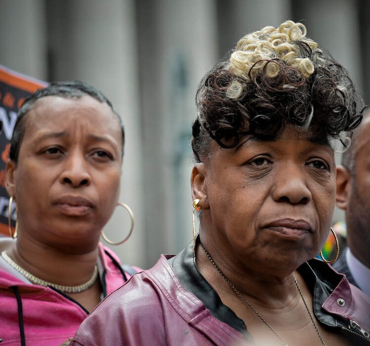 (AP Photo/Bebeto Matthews) In this Thursday May 9, 2019 photo, Ellisha Garner, left, and Gwen Carr, right, her mother and mother of Eric Garner, an unarmed black man who died as he was being subdued in a chokehold by police officer Daniel Pantaleo nearly five years ago, hold a press conference after leaving court in New York. A judge cleared the way for a police disciplinary trial to begin next week for Pantaleo in the death of Garner, after rejecting his claim that a police watchdog agency didn't have jurisdiction to prosecute the case.
