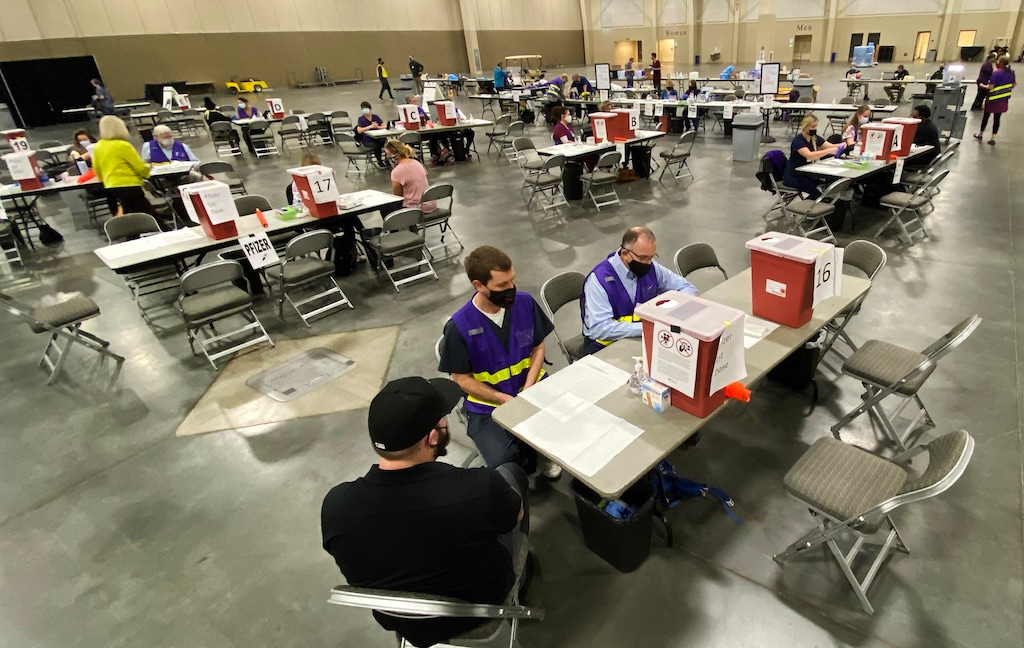 (Rick Egan | The Salt Lake Tribune)  COVID-19 vaccinations at the Mountain America Expo site in Sandy on Monday, March 8, 2021.