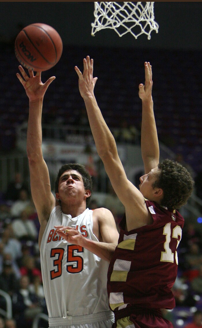 (Steve Griffin  |  Tribune File Photo)  Brighton's Travis Devashrayee lays in two points over Viewmont's  McKay Johnson during 5A state basketball game against Viewmont at the Dee Events Center in Ogden, Utah Wednesday February 27, 2013.