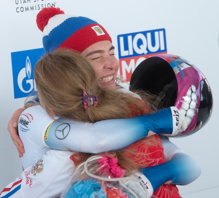 (Rick Egan  |  The Salt Lake Tribune)  Elena Nikitina, Russia, gets a hug as she realizes she won first place in the BMW IBSF World Cup Skeleton competition, in Park City, Saturday, November 18, 2017.
