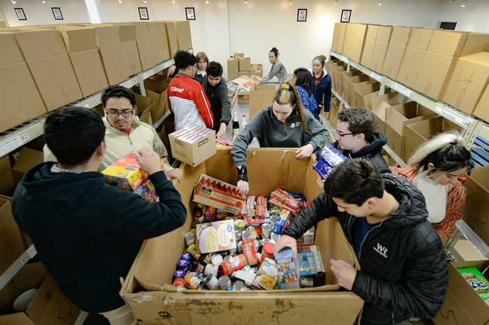 (Francisco Kjolseth  |  The Salt Lake Tribune) Members of YouthCity Government that involves teens in state-organized, model-government programs, volunteer their time assembling pallets of food at the Utah Food Bank on Monday, Jan. 20, 2020, to celebrate the 2020 Martin Luther King Jr. Day of Service.