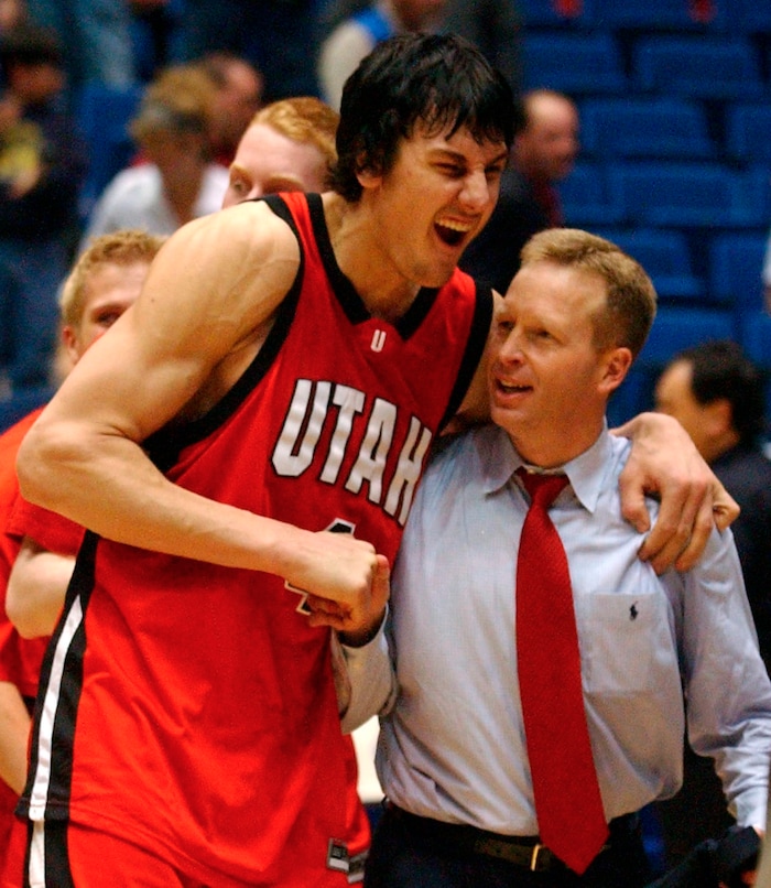Andrew Bogut and Coach Giacoletti embrace after the game as the utes disposed of the Sooners to move on to the next round.  photo by Rick Egan 3/19/2005