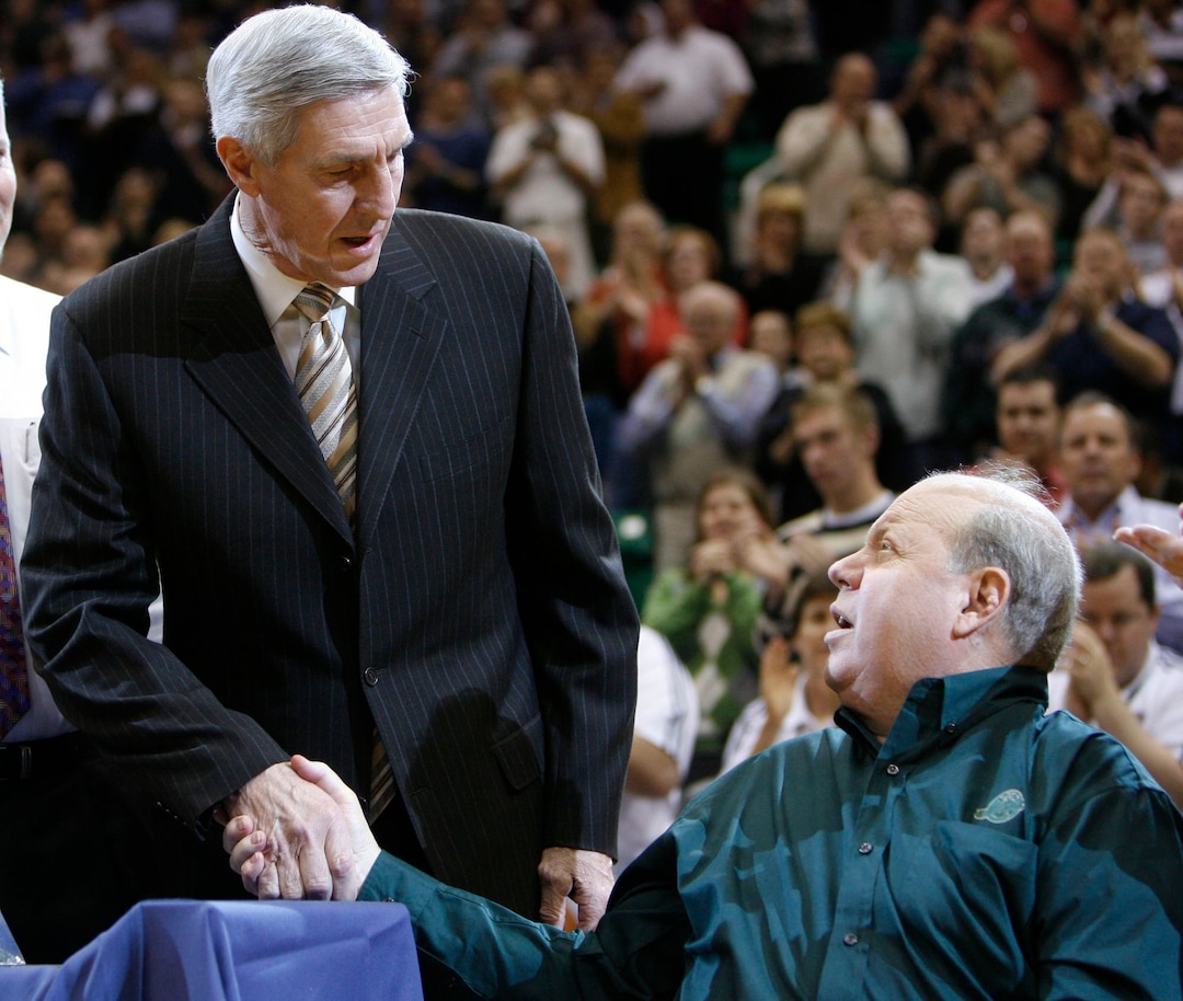 (Steve Griffin  |  Tribune file photo) Jerry Sloan shakes hands with team owner Larry Miller as Sloan is honored for winning his 1000 game prior to the start of the Utah Jazz Milwaukee Bucks game at the EnergySolutions Arena Wednesday  November 19, 2008.  