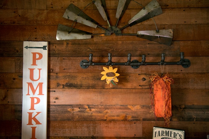 (Benjamin Zack | Standard-Examiner via AP) A living room wall in Gaelynn and Paul Sewell's new home is built from pieces of their old fence that Paul salvaged after a tornado destroyed their old home in Washington Terrace, Utah.
