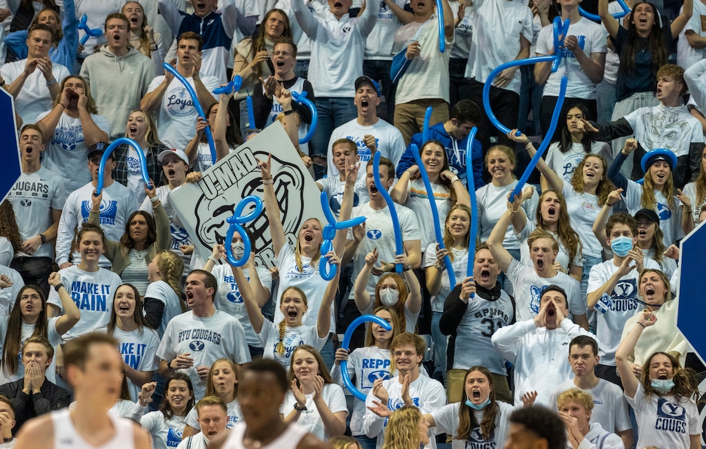 Rick Egan | The Salt Lake Tribune)  BYU basketball fans cheer as the Cougars extend their lead in the final minutes of a game against the San Diego Toreros at the Marriott Center on Jan. 20, 2022.
