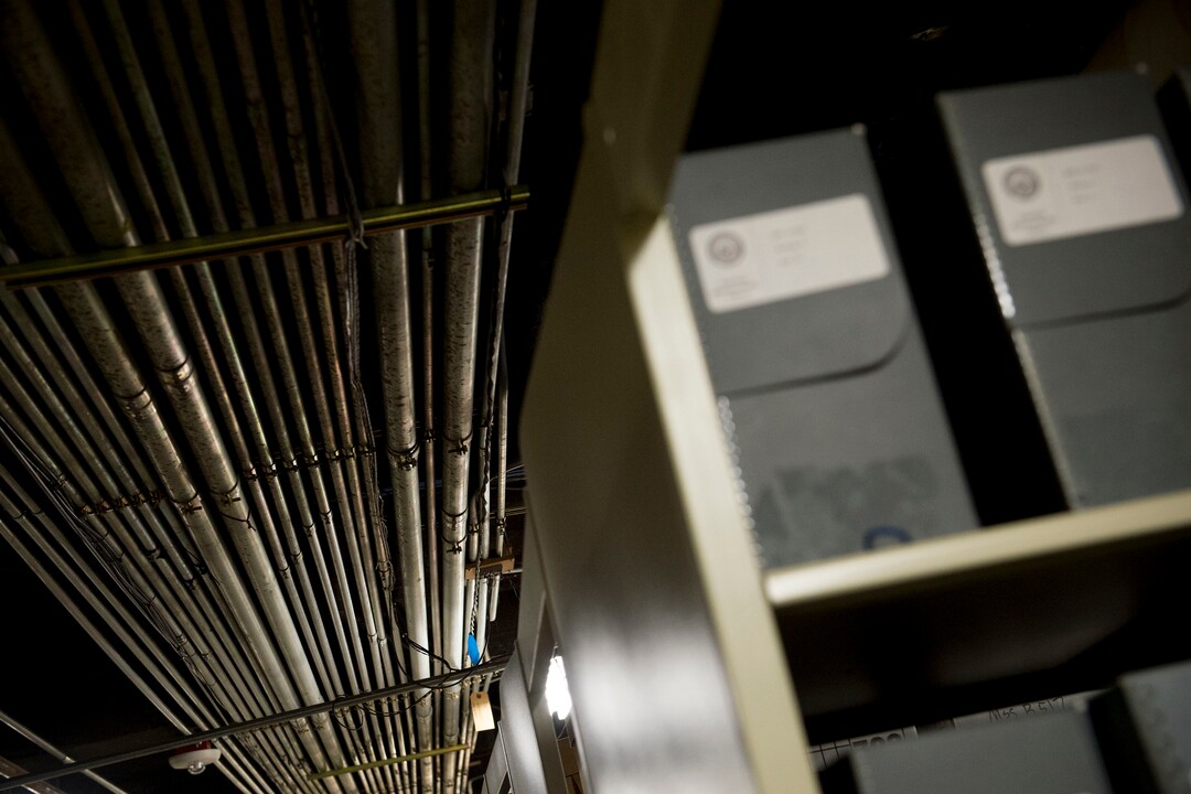 (Jeremy Harmon  |  The Salt Lake Tribune) Old pipes run above boxes of historic documents in the basement of the Rio Grande Depot, home of the Utah state historical offices, on Feb. 15, 2018.