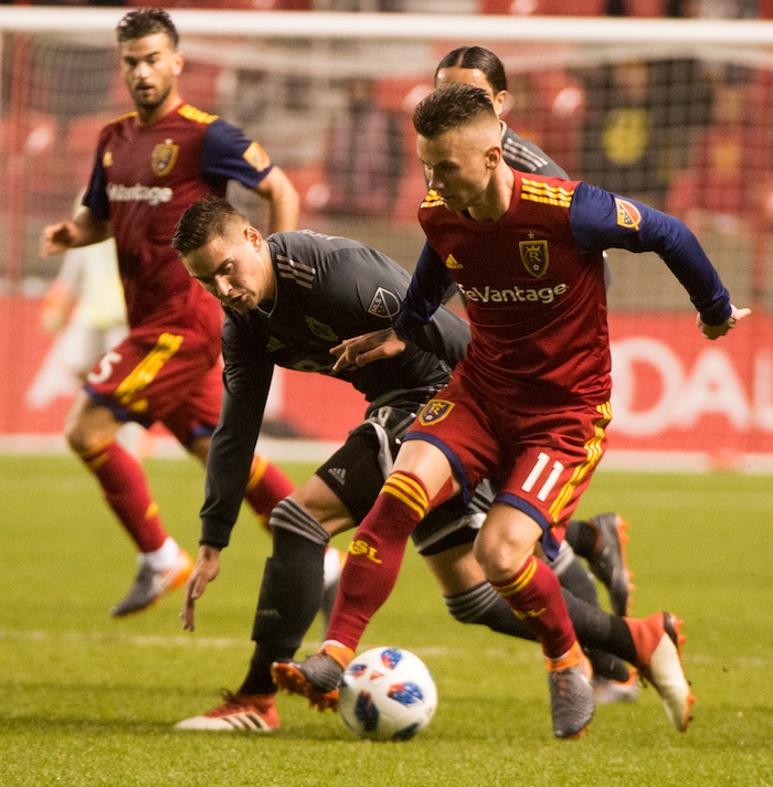 (Rick Egan  |  The Salt Lake Tribune)      Real Salt Lake midfielder Albert Rusnak (11) brings the ball upfield as Vancouver Whitecaps defender Jake Nerwinski (28) defends, in MLS action between Real Salt Lake and Vancouver Whitecaps, at Rio Tinto Stadium beSaturday, April 7, 2018.


