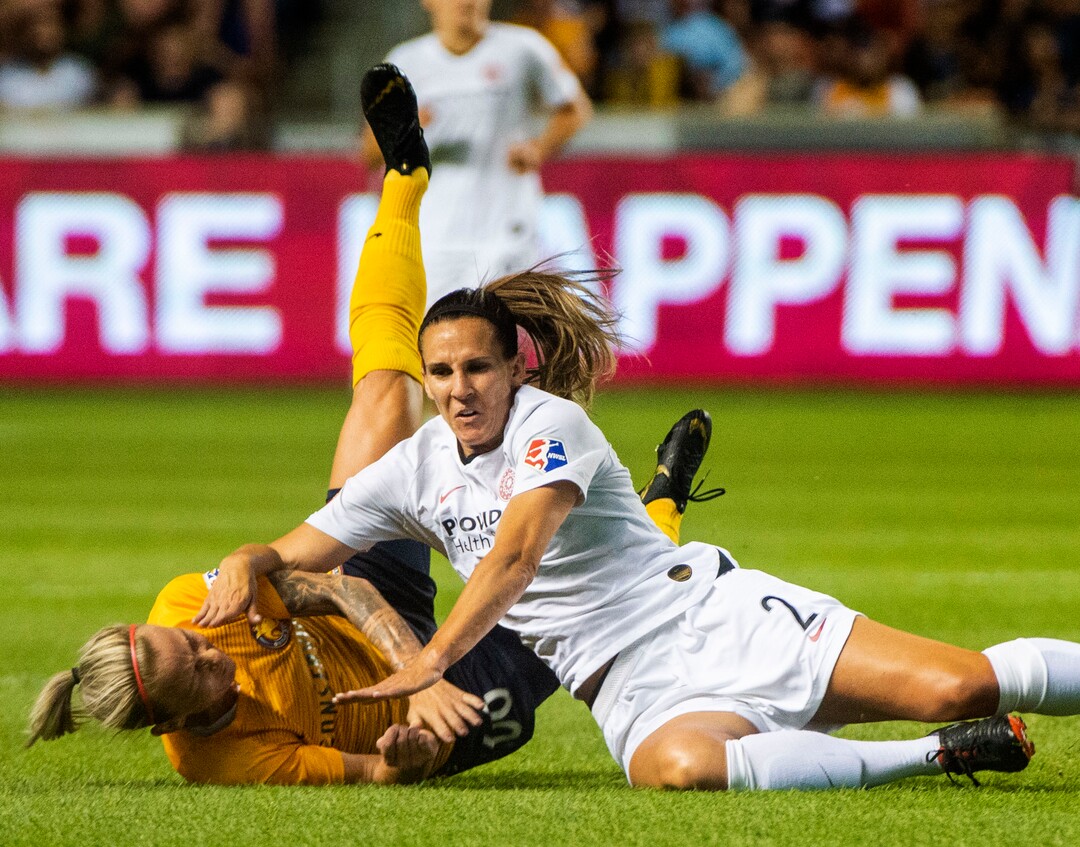 (Rick Egan  |  The Salt Lake Tribune)    Utah Royals FC midfielder Gunnhildur Jónsdóttir (66) collides with Portland Thorns FC defender Katherine Reynolds (2), in Soccer action between Utah Royals FC and Portland Thorns FC, in Sandy, Friday, July 19, 2019.