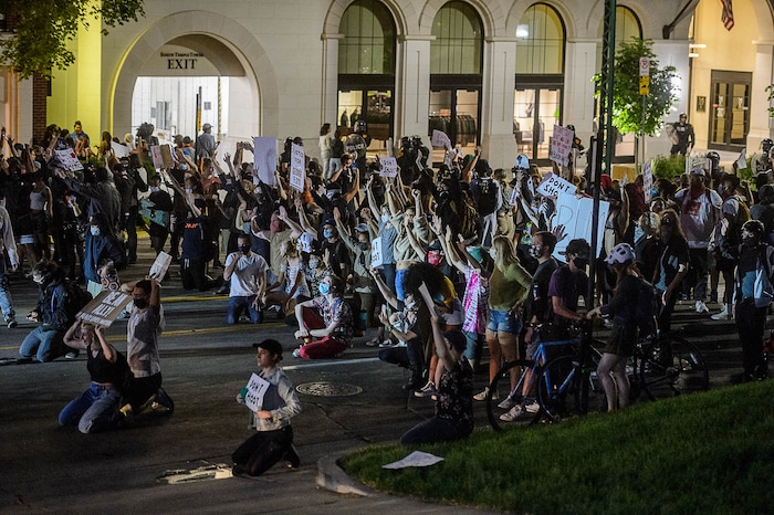 (Trent Nelson  |  The Salt Lake Tribune) A group of protesters are told they'll be arrested while marching after curfew in Salt Lake City on Monday, June 1, 2020. They were let go shortly after.