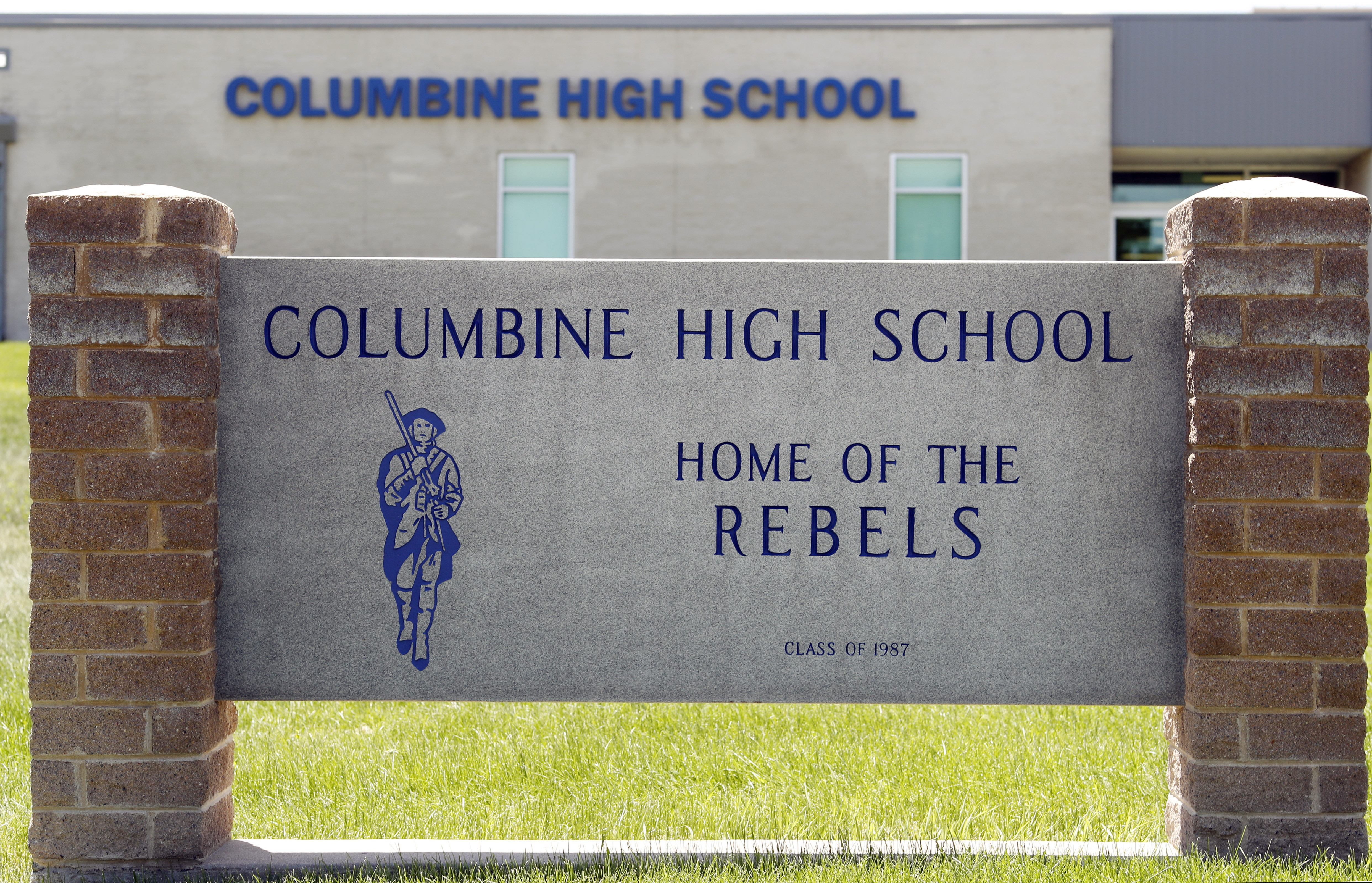 (David Zalubowski | AP Photo) Signs outside Columbine High School are photographed, Thursday, June 13, 2019, in Littleton, Colo. The school district is considering the demolition of Columbine, the scene of a mass assault more than 20 years ago, and rebuilding the current school.