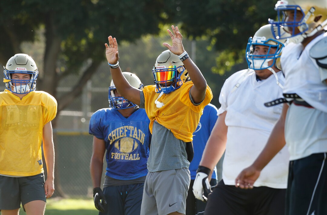 (Gary Kazanjian | Special to The Tribune) Clovis High School quarterback Nate Johnson works out with his team at Clovis High School, who committed to play for the University of Utah, shown Wednesday, July 28, 2021, in Clovis, Calif.