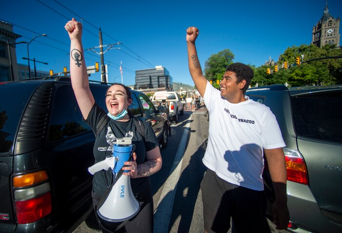 (Rick Egan  |  The Salt Lake Tribune) Sofia Alcala and Emanuel Hill cheer as cars honk to show support as they block traffic on 400 South in Salt Lake City during a demonstration for Bernardo Palacios-Carbajal on Monday, June 22, 2020.
