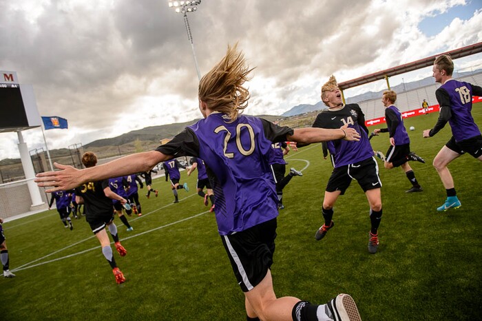 (Trent Nelson | The Salt Lake Tribune)  Desert Hills players celebrate their win over Park City High School in the 4A state championship game, Saturday May 12, 2018.