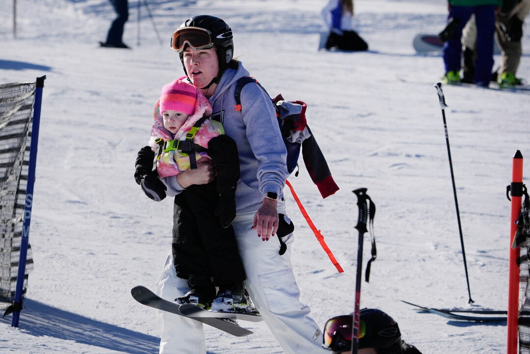 (Francisco Kjolseth | The Salt Lake Tribune) Amy Hawkins introduces her daughter Claire, 1, to skiing for the first time as they take to the bunny slope at Park City Mountain Resort on Saturday, Dec. 18, 2021.
