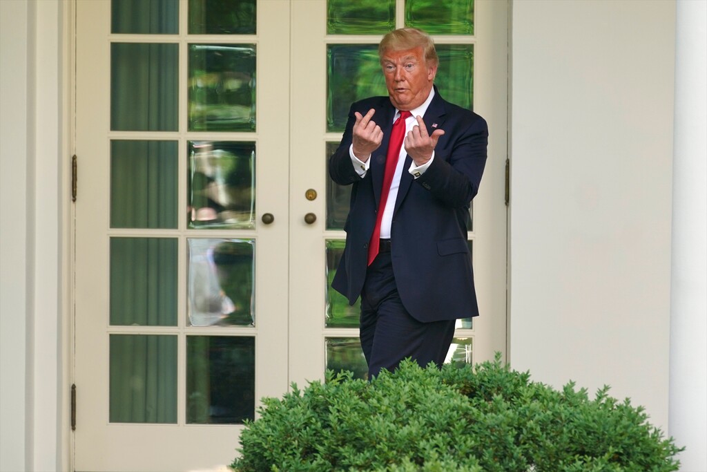 President Donald Trump gestures to people in the audience after an event on protecting seniors with diabetes in the Rose Garden White House, Tuesday, May 26, 2020, in Washington. (AP Photo/Evan Vucci)