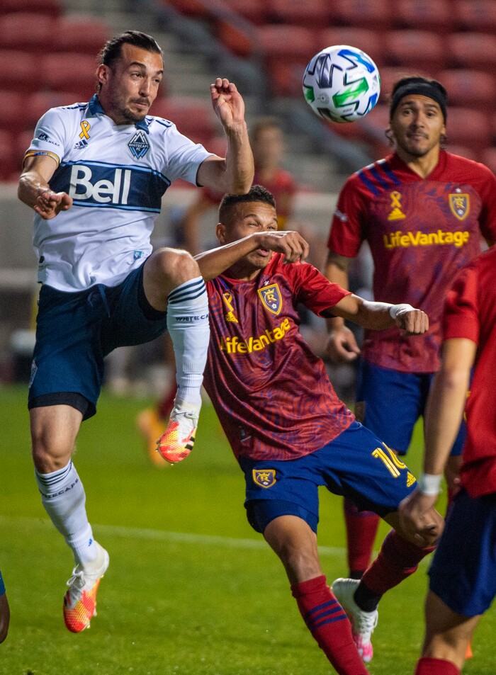 (Rick Egan  |  The Salt Lake Tribune)   Vancouver Whitecaps midfielder Russell Teibert (31) collides with Real Salt Lake midfielder Maikel Chang (16), in MLS soccer action between Real Salt Lake and the Vancouver Whitecaps at Rio Tinto Stadium on Saturday, Sept. 19, 2020.

 