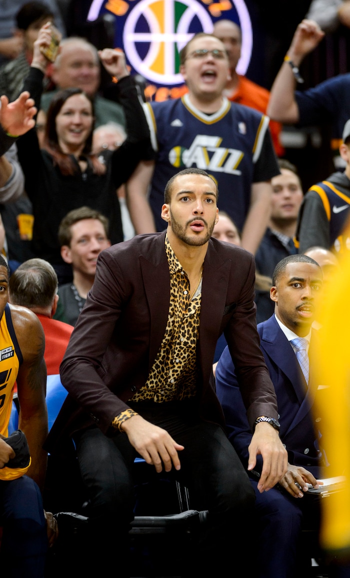 (Steve Griffin  |  The Salt Lake Tribune) Dressed in street clothes Utah Jazz center Rudy Gobert (27) jumps up from the bench as the Jazz go on a run during the Utah Jazz versus Denver Nuggets NBA basketball game at Vivint Smart Home Arena  in Salt Lake City Tuesday November 28, 2017.