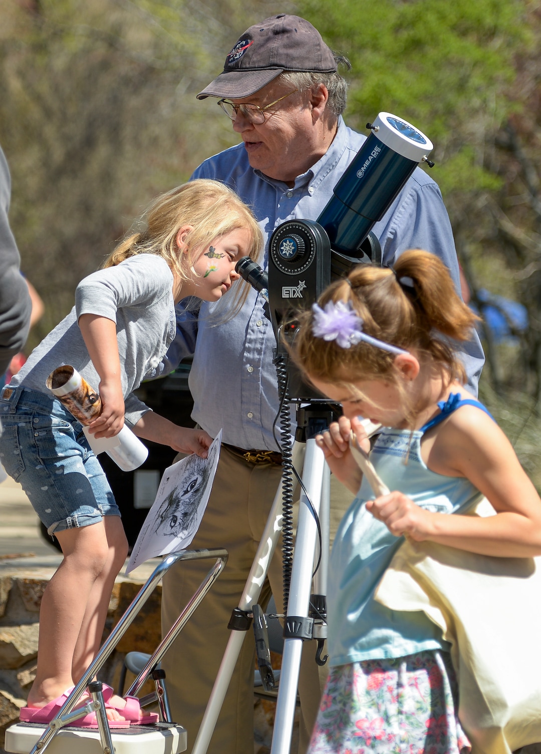 Leah Hogsten  |  The Salt Lake Tribune  "A million earths can fit inside the sun," said retired Weber State University physics professor Brad Carroll as Judy Farley gets a close up look at the sun during Earth Day celebration at the Ogden Nature Center, Saturday, April 20, 2019. 