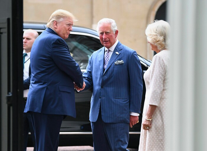 US President Donald Trump, left,  is greeted by Britain's Prince Charles and Camilla, the Duchess of Cornwall prior to afternoon tea at Clarence House, in London, Monday, June 3, 2019. Trump is on a three-day state visit to Britain. (Victoria Jones/Pool Photo via AP)