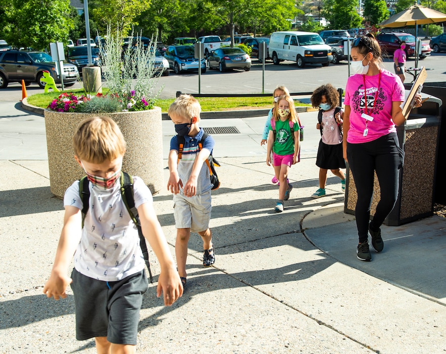 (Rick Egan  |  The Salt Lake Tribune) Bianca Allen asks the children to walk like mummies to help with social distancing as they enter the Jewish Community Center on Thursday, July 2, 2020.