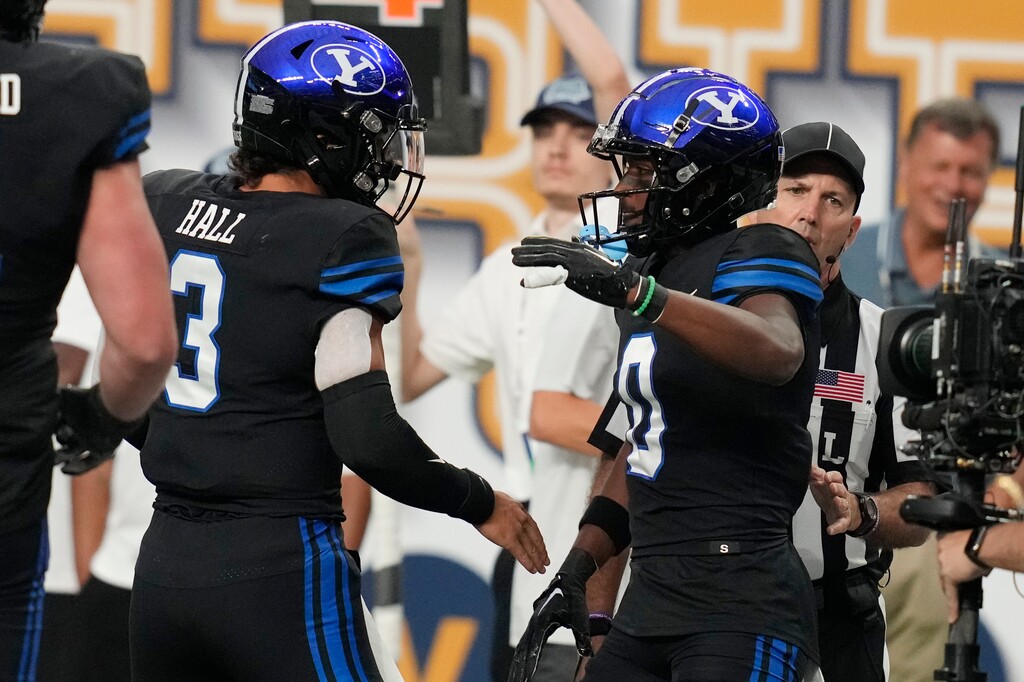 (John Locher | AP) BYU quarterback Jaren Hall (3), celebrates after wide receiver Kody Epps (0) scored a touchdown against Notre Dame during the first half of an NCAA college football game Saturday, Oct. 8, 2022, in Las Vegas.